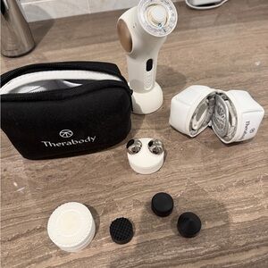 Therabody TheraFace Pro with original and optional heat/cool attachments